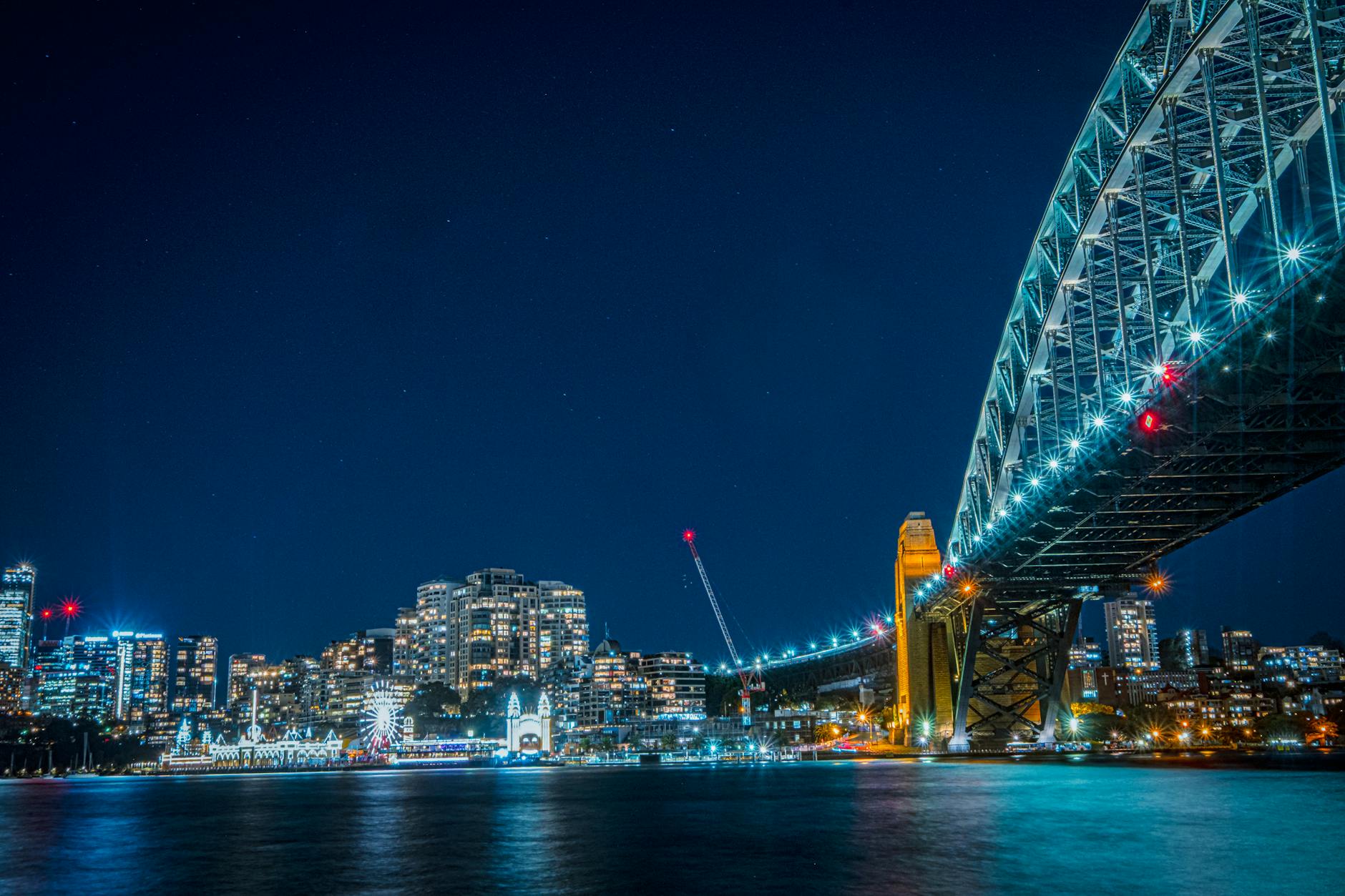 Luna Park Sydney sits beneath the iconic Harbour Bridge