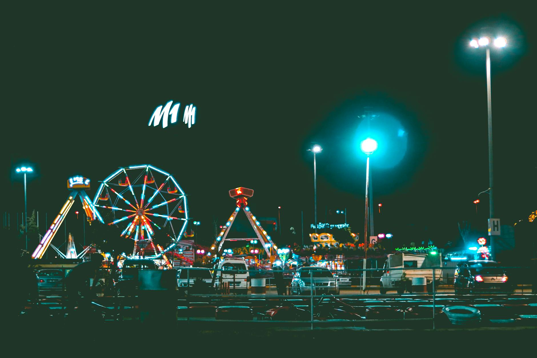 Luna Park Sydney lit up at night with harbour views