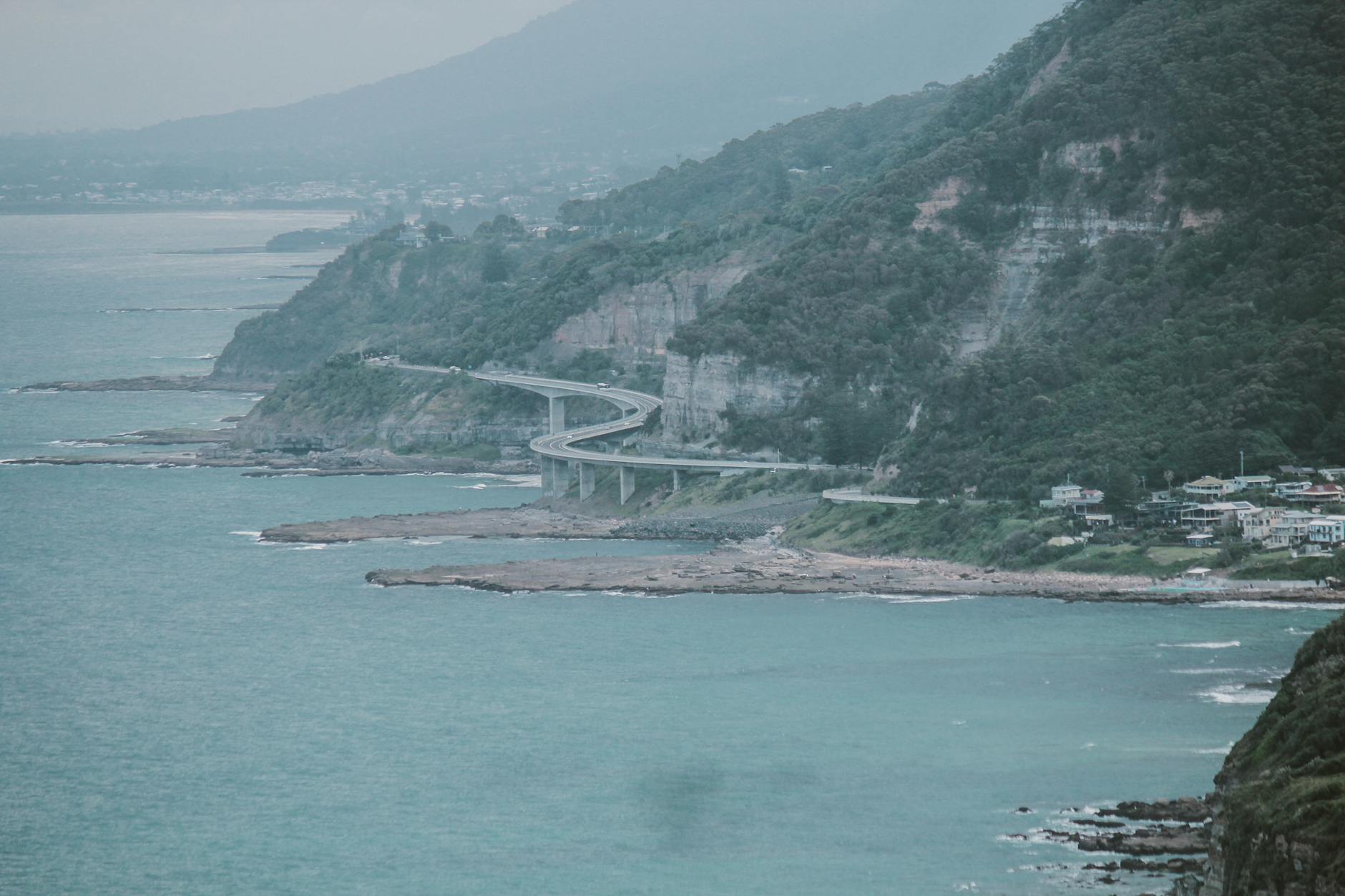 Day trips from Sydney - Scenic Sea Cliff Bridge winding along the coast on the Grand Pacific Drive to Wollongong from Sydney.