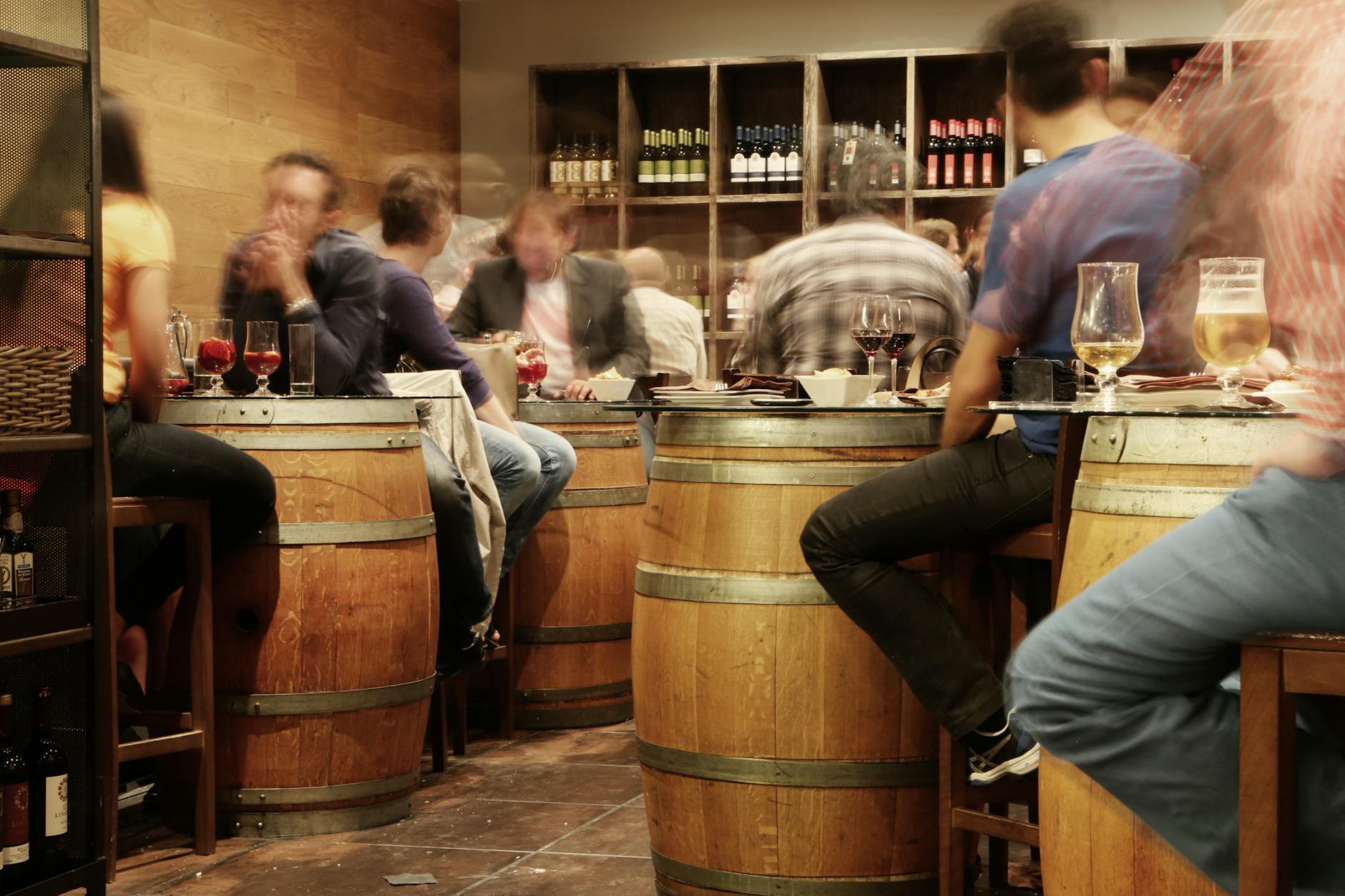 Friends enjoying wine and dining at a cosy Sydney wine bar