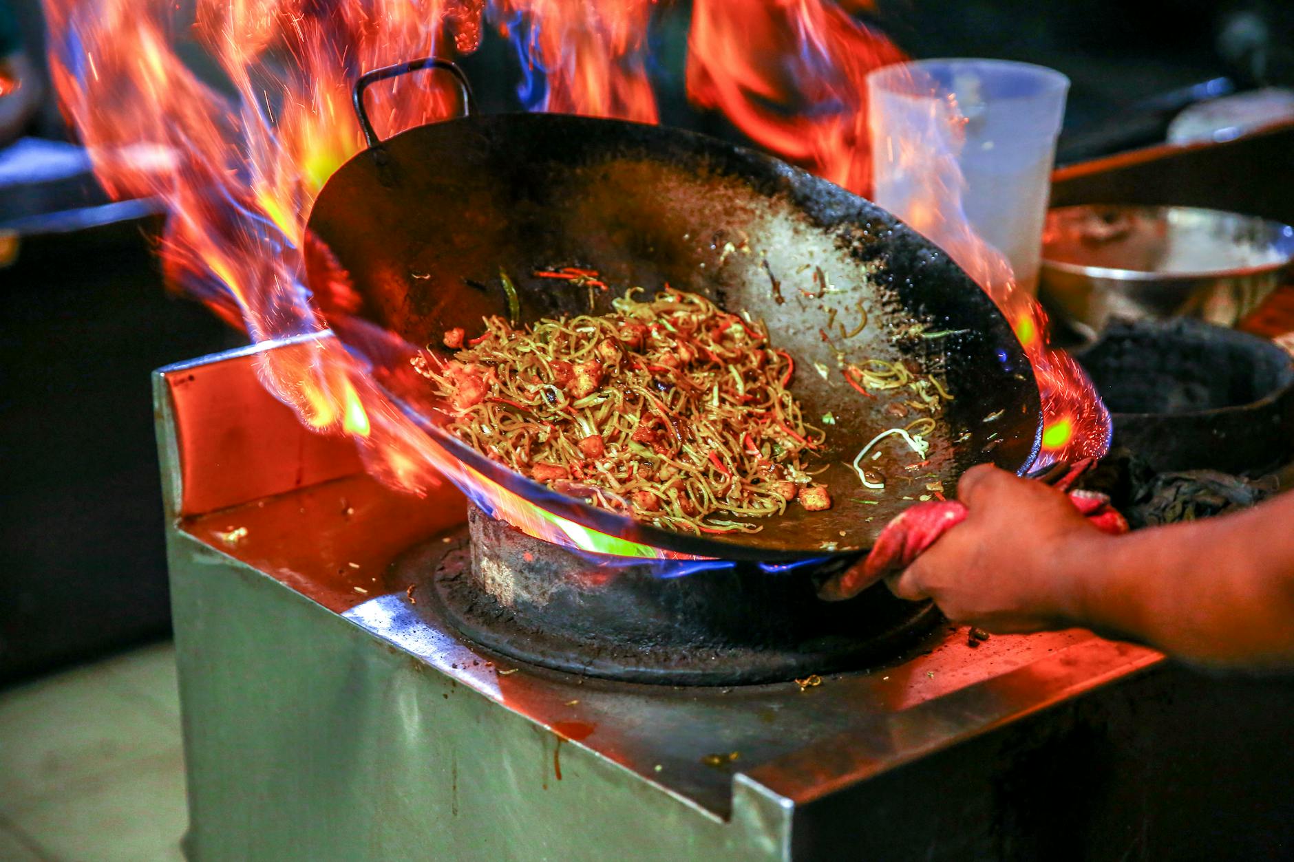 Sydney Chinatown food - chef stir-frying in wok