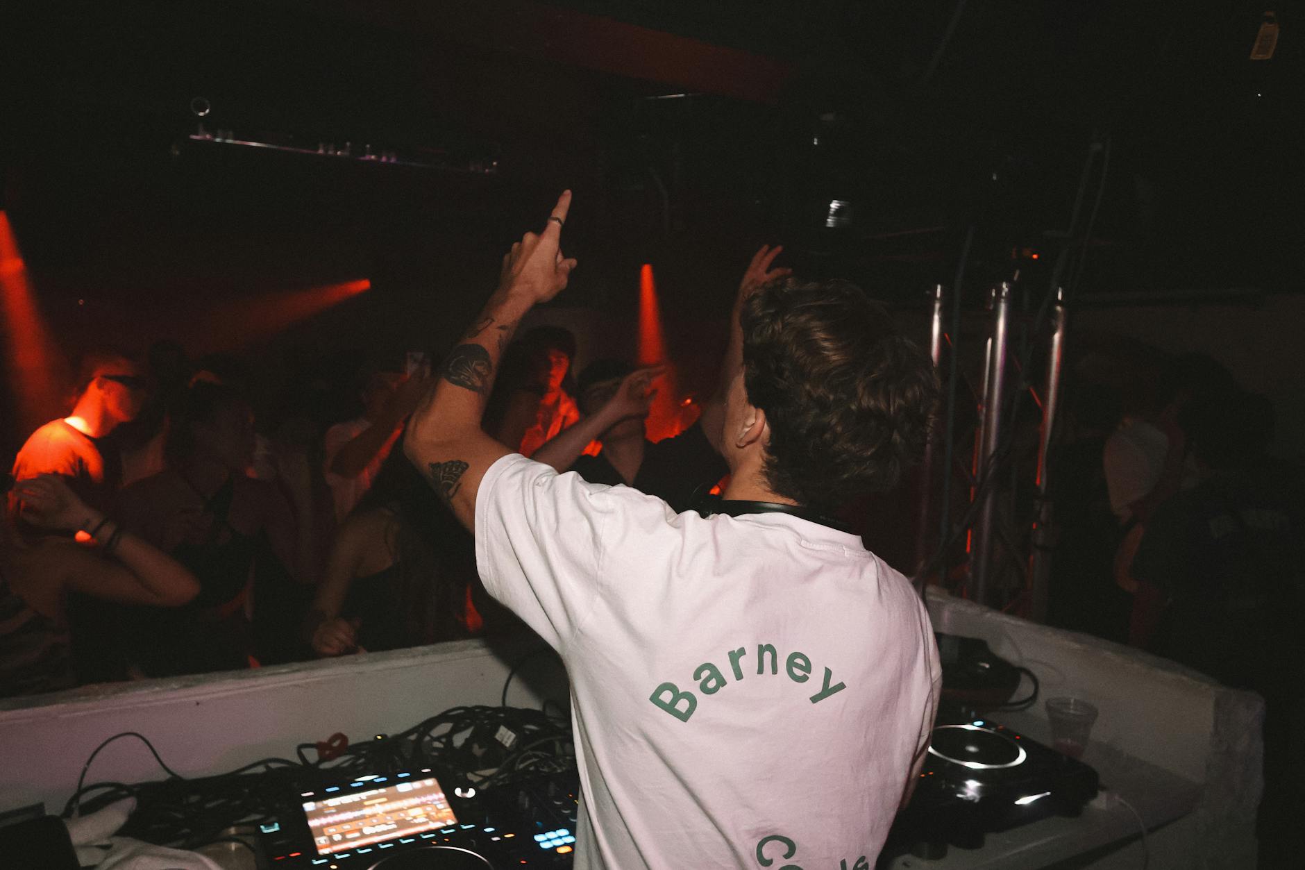 Sydney nightlife - DJ at club with dancing crowd