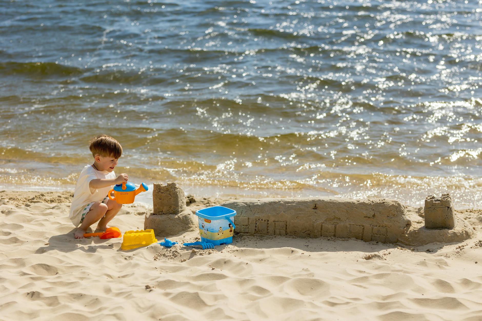 Sydney with kids - children building sandcastles at beach