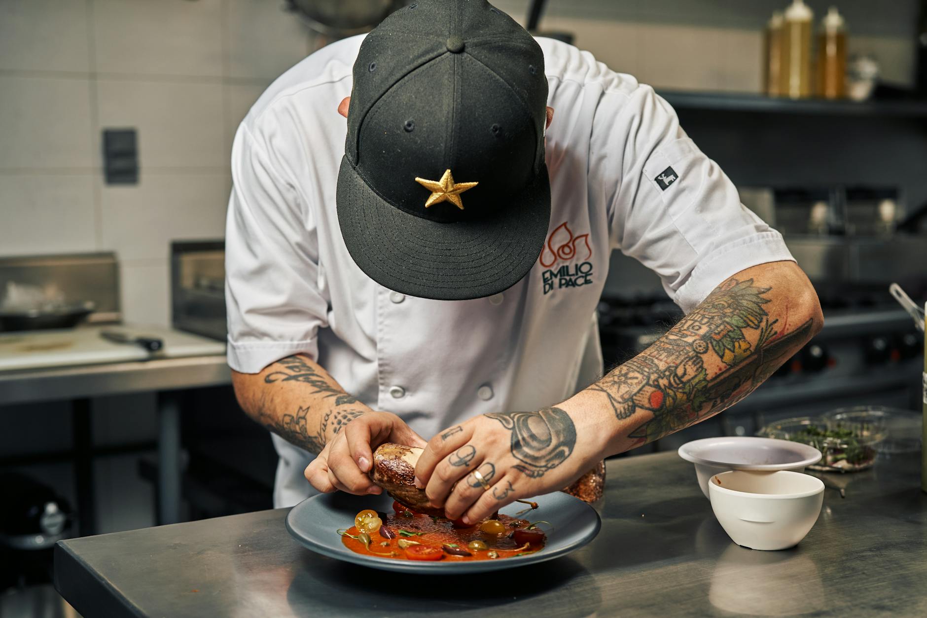 Fine dining Sydney - chef plating at restaurant kitchen