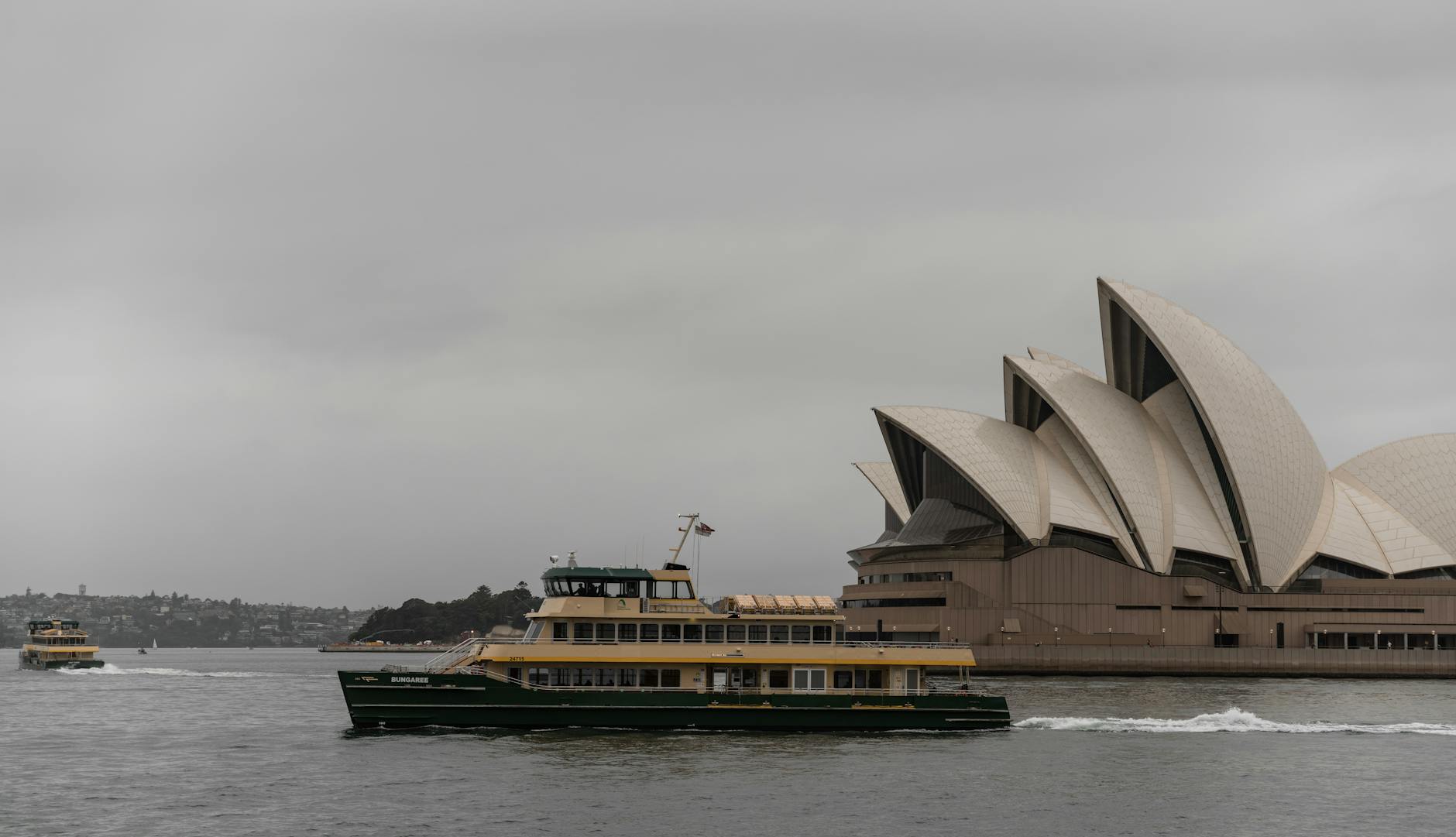Sydney ferries - Manly ferry crossing harbour with Opera House