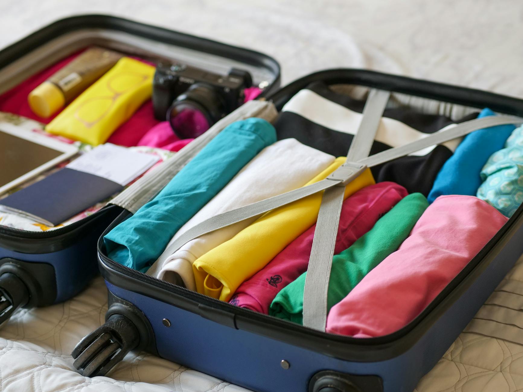 What to pack for Sydney - open suitcase with clothing folded