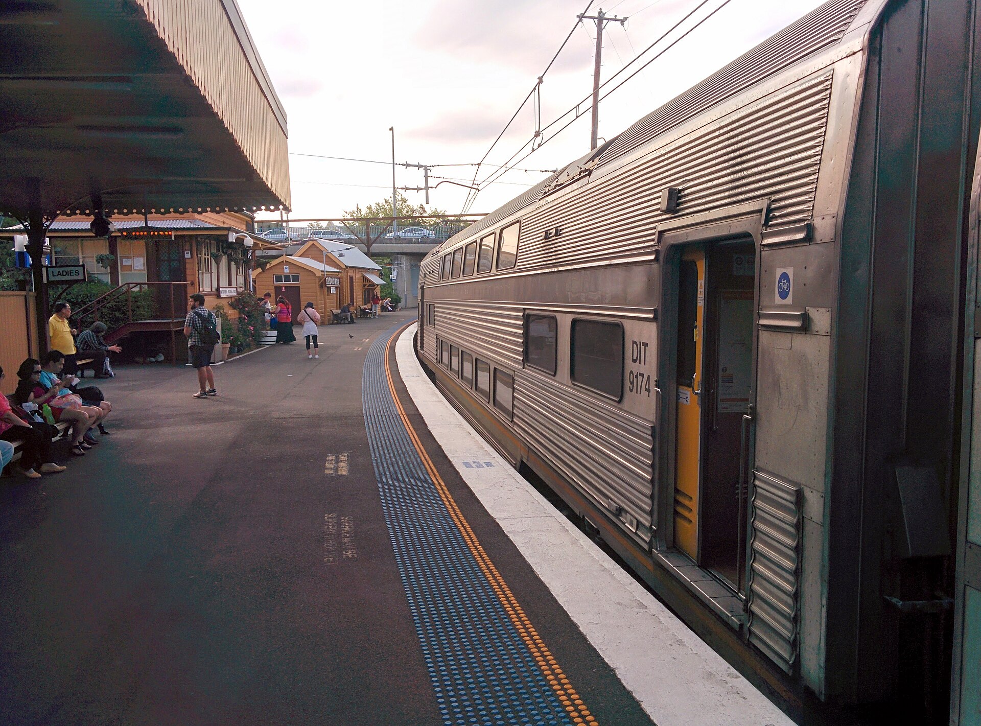 Intercity train at the platform beside the heritage station buildings at Katoomba
